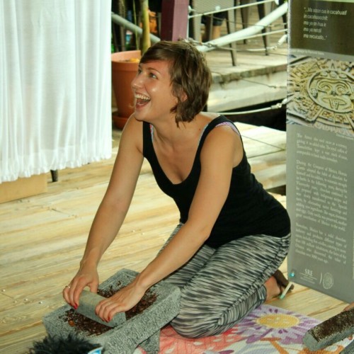 Grinding cacao on the metate